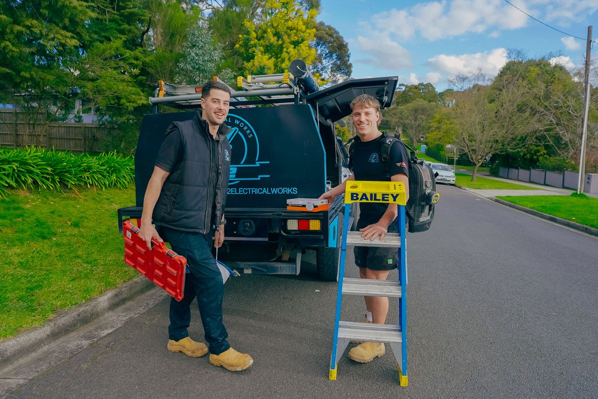 Two 22 Electrical Works electricians with their branded ute on a Croydon Hills street