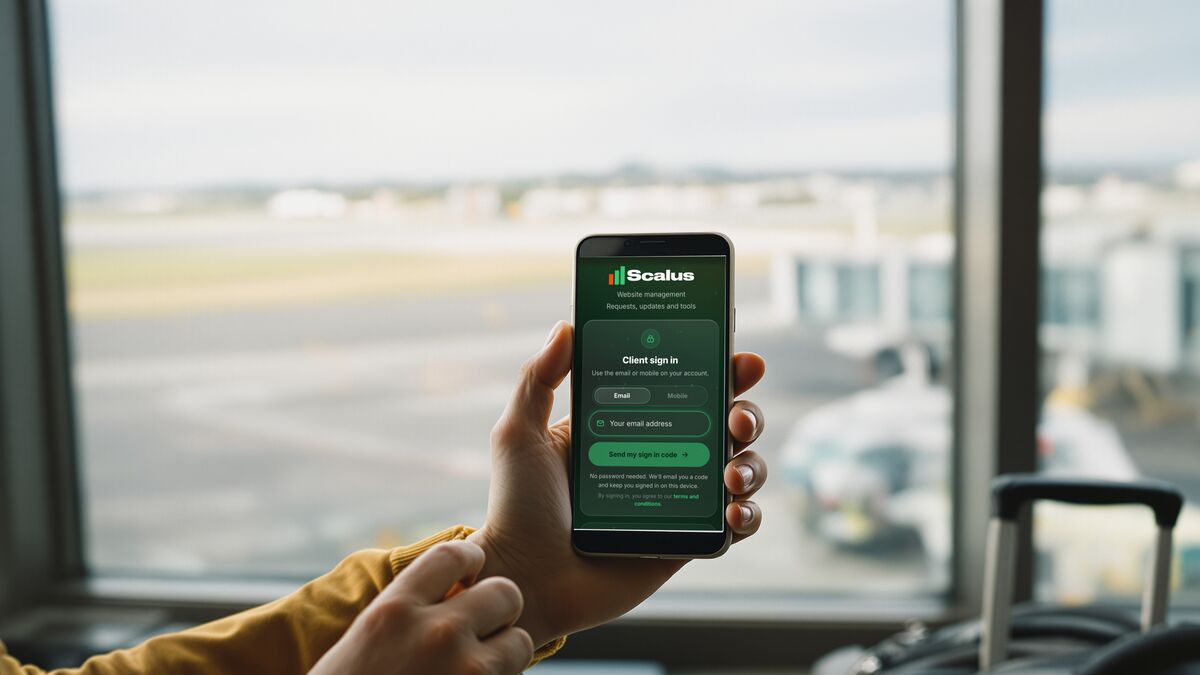 A phone showing the Scalus App, held up at an airport window