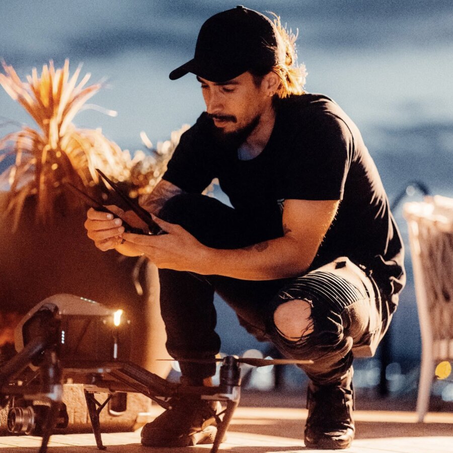 Tim McCartney setting up a drone at dusk