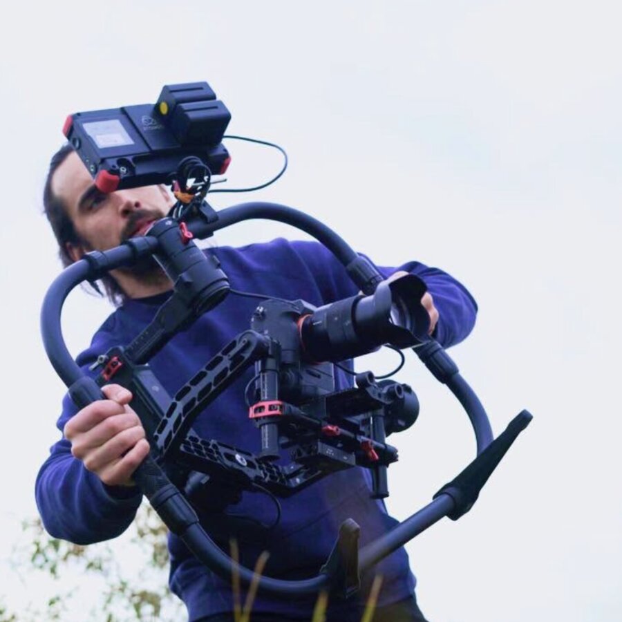 Tim McCartney operating a gimbal, seen from a low angle