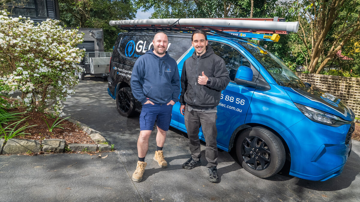 Tim McCartney with Michael from Glow Electrical beside the Glow van